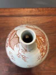 A Chinese iron-red-decorated and gilt 'dragon and carp' bottle vase, 19/20th C.