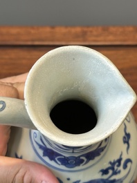 A Chinese blue and white ewer with landscape design, Transitional period