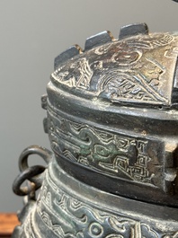 A Chinese bronze ritual wine vessel and cover, 'you', Yuan/Ming