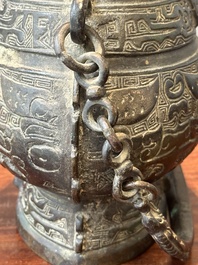 A Chinese bronze ritual wine vessel and cover, 'you', Yuan/Ming