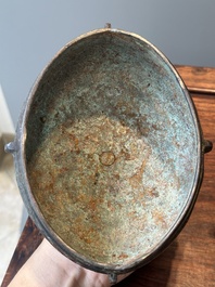 A Chinese bronze ritual wine vessel and cover, 'you', Yuan/Ming