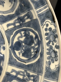 A large Chinese blue and white Swatow dish with a lobster and a carp at a fishing village, Ming