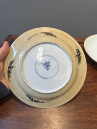 A Chinese famille verte caf&eacute;-au-lait ground plate and a monochrome white plate, Kangxi