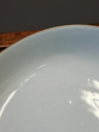 A Chinese famille verte caf&eacute;-au-lait ground plate and a monochrome white plate, Kangxi