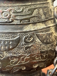 A Chinese bronze ritual wine vessel and cover, 'you', Yuan/Ming