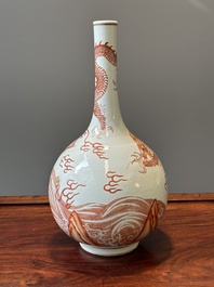 A Chinese iron-red-decorated and gilt 'dragon and carp' bottle vase, 19/20th C.