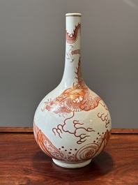 A Chinese iron-red-decorated and gilt 'dragon and carp' bottle vase, 19/20th C.