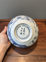 A Chinese blue and white 'mandarin ducks in a lotus pond' bowl, Chenghua mark, Wanli