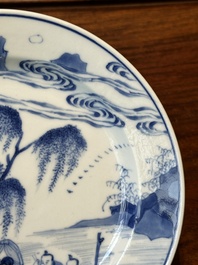 A Chinese blue and white plate with a breastfeeding woman and fishermen on boats, Chenghua mark, Kangxi