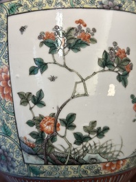 A Chinese famille verte covered vase and a bottle vase, 19th C.