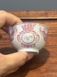 A 28-piece Chinese puce-enamelled and gilt armorial tea service with crowned monograms, Qianlong