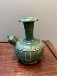 Two Chinese monochrome green-glazed stoneware 'dragon' vases and a kendi, Fujian kiln, late Ming