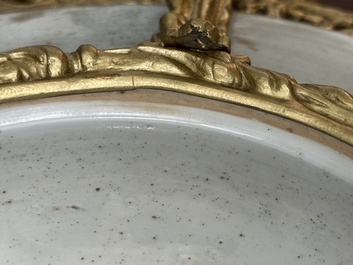 A Chinese famille rose 'flower basket' dish with gilt bronze mount, Yongzheng