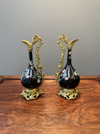 A pair of Chinese black-ground famille rose vases with gilt bronze mounts, Yongzheng