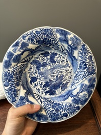 Four Chinese blue and white lobed 'phoenix and monkey' plates, flower mark, Kangxi
