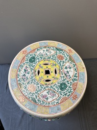 A Chinese famille rose garden seat with birds among blossoming branches, 19th C.