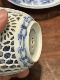 A Chinese blue and white reticulated double-walled cup and saucer, Kangxi