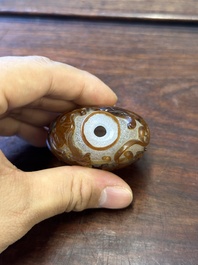 A rare Chinese brown-overlay white glass snuff bottle with chilong design, Qianlong/Jiaqing