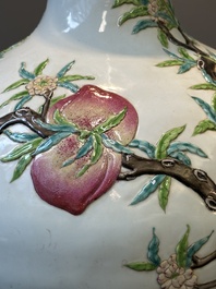 A Chinese famille rose relief-molded 'tianqiuping' vase with nine peaches, Qianlong mark, 19/20th C.