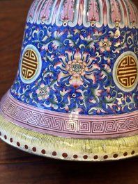 A large Chinese Canton enamel blue-ground 'shou' candlestick, Qianlong/Jiaqing