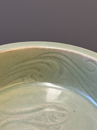 A Chinese Longquan celadon dish with floral anhua design, Ming