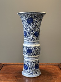 A Chinese blue and white 'chrysanthemum scroll' 'gu' vase, Kangxi