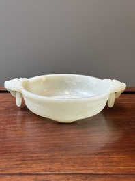 An important Chinese chrysanthemum-shaped very pale celadon jade marriage bowl, 18th C.