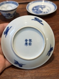 Four Chinese blue and white saucers and an 'erotic' cup, Kangxi