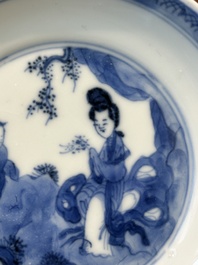 Four Chinese blue and white saucers and an 'erotic' cup, Kangxi
