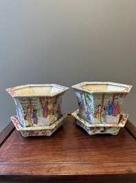 A pair of hexagonal Chinese Canton famille rose jardinieres on stands, 19th C.