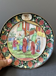 A pair of Chinese monogrammed Canton famille rose plates with black-glazed rims, 19th C.
