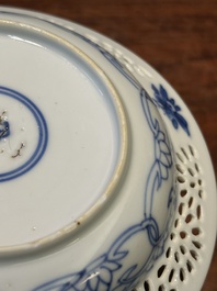 A Chinese blue and white reticulated double-walled cup and saucer, Kangxi