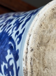 A Chinese blue and white 'lotus scroll' jar with wooden cover and stand, Kangxi