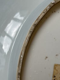 A Chinese blue and white dish with landscape and floral panels, Kangxi