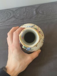 A Chinese famille rose '18 Luohan' bottle vase, 19th C.