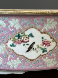 A Chinese iron-red-decorated covered bowl and a famille rose covered bowl, 19th C.