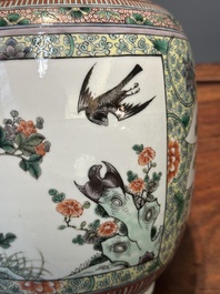 A Chinese famille verte covered vase and a bottle vase, 19th C.