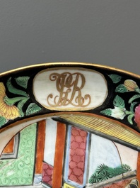 A pair of Chinese monogrammed Canton famille rose plates with black-glazed rims, 19th C.