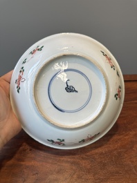 A Chinese famille verte 'qilin and falcon' plate, artemisia leaf mark, Kangxi