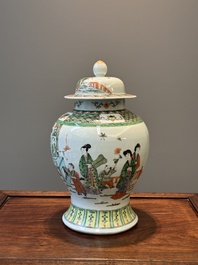 A Chinese famille verte covered vase and a bottle vase, 19th C.