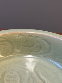 A Chinese Longquan celadon dish with floral anhua design, Ming