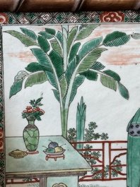 A rectangular Chinese famille verte plaque in a wooden faux bamboo frame, Kangxi