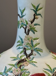 A Chinese famille rose relief-molded 'tianqiuping' vase with nine peaches, Qianlong mark, 19/20th C.