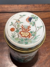 A Chinese famille verte cylindrical box and cover with gilt bronze mount, Kangxi