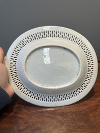 An oval Chinese Canton famille rose dish with a reticulated border, 19th C.