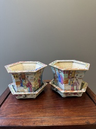 A pair of hexagonal Chinese Canton famille rose jardinieres on stands, 19th C.