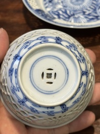 A Chinese blue and white reticulated double-walled cup and saucer, Kangxi