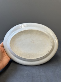 An oval Chinese monogrammed Canton famille rose dish with landscape design, 19th C.
