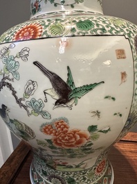 A pair of Chinese famille verte 'bird and flower' vases and covers, Kangxi mark, 19th C.