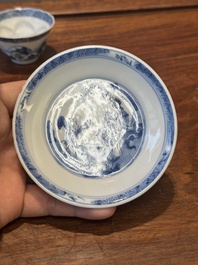 Four Chinese blue and white saucers and an 'erotic' cup, Kangxi